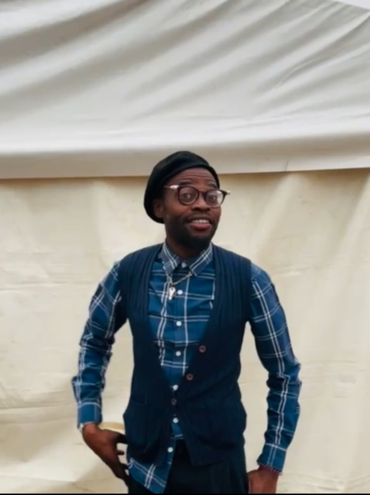 Bongi Namane standing with his hands in the pocket smiling