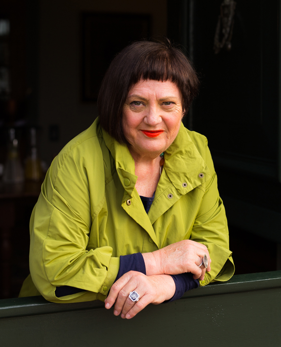 Food writer Errieda du Toit smiling in a kitchen setting, surrounded by the warmth of South Africa’s food community.