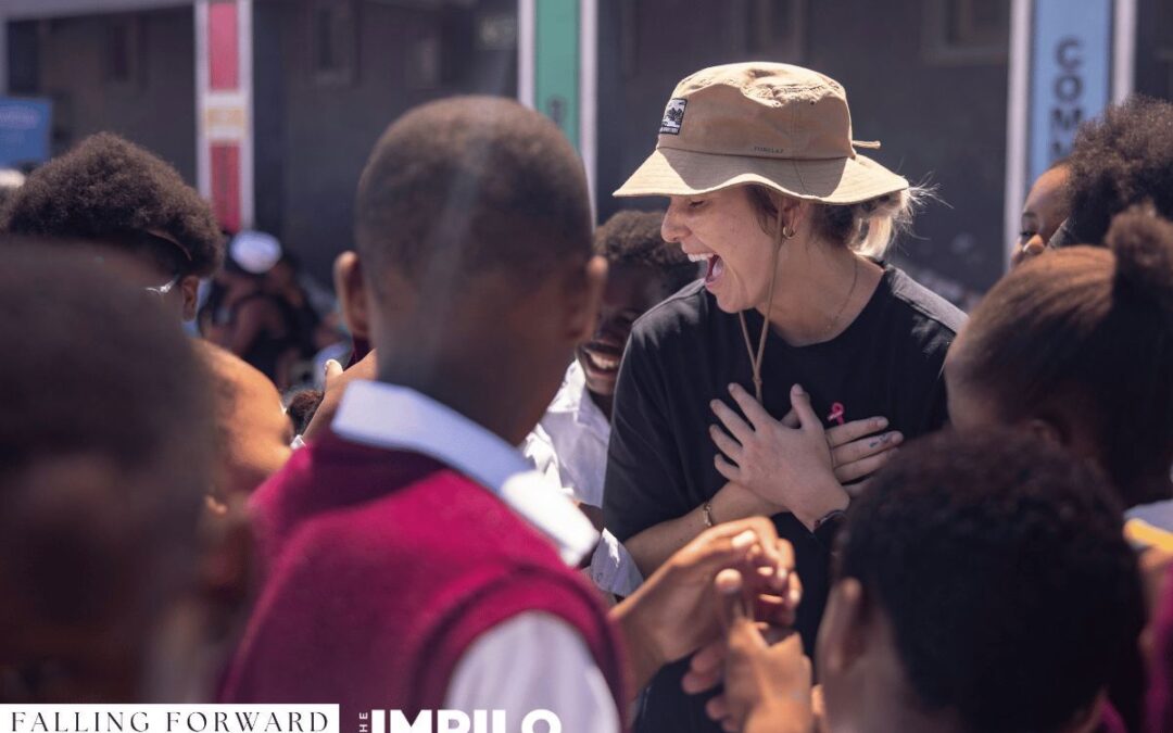 Healthcare workers and volunteers assisting community members during a collaborative health day in Cape Town.