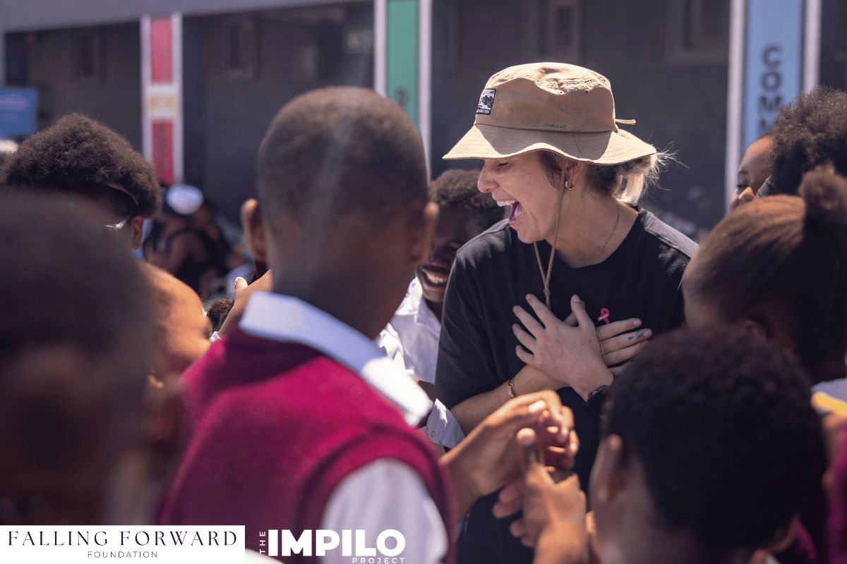 Healthcare workers and volunteers assisting community members during a collaborative health day in Cape Town.