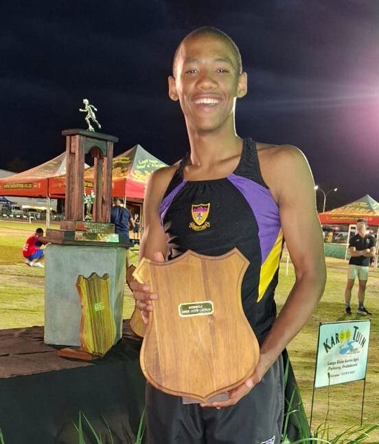Young Oudtshoorn sprinter Aquila Julies on an athletics track, ready for an international schools tour.