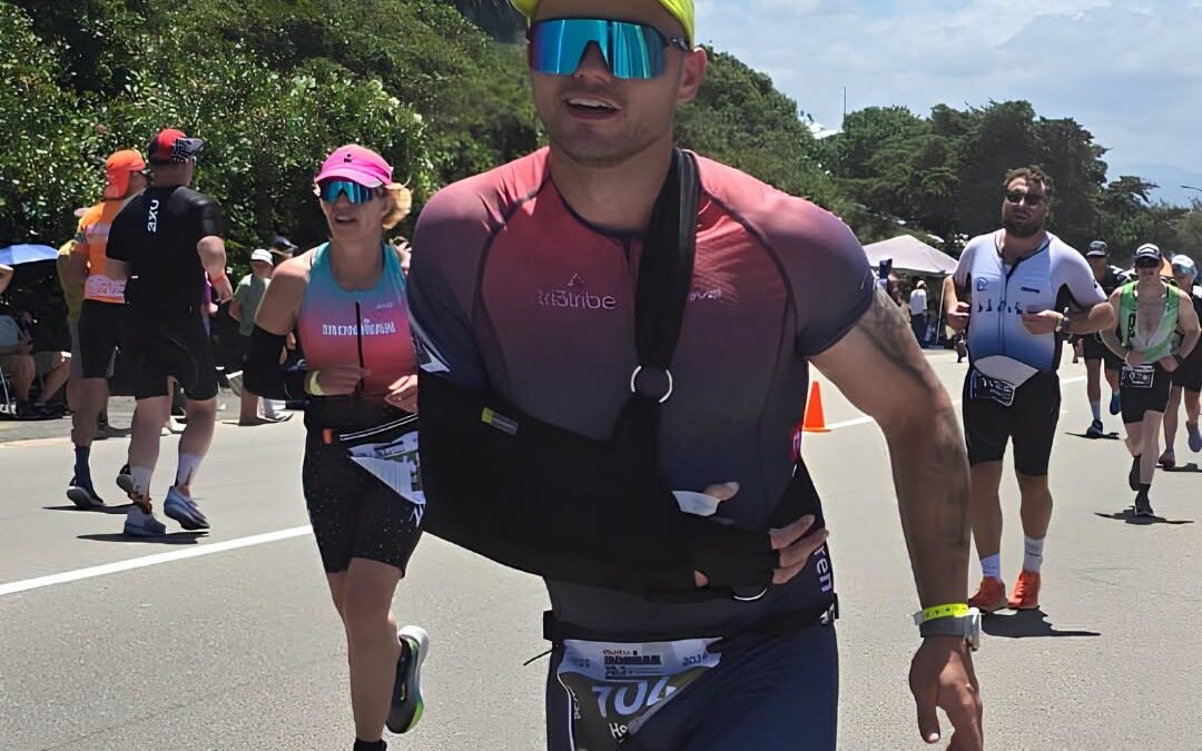 Henno Hendrikse competing in an endurance event during his Ironman journey