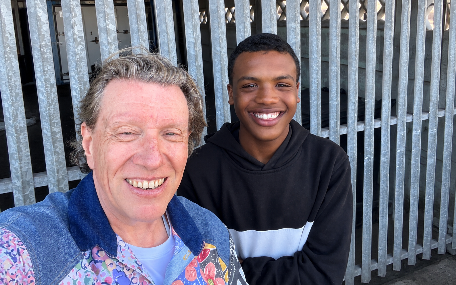 reece-image-only Reece smiling alongside a supporter